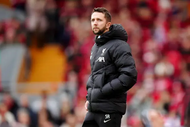 Liverpool manager assistant Scott Rogers looks on