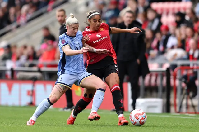 Bethany England of Tottenham Hotspur is challenged by Gabby George