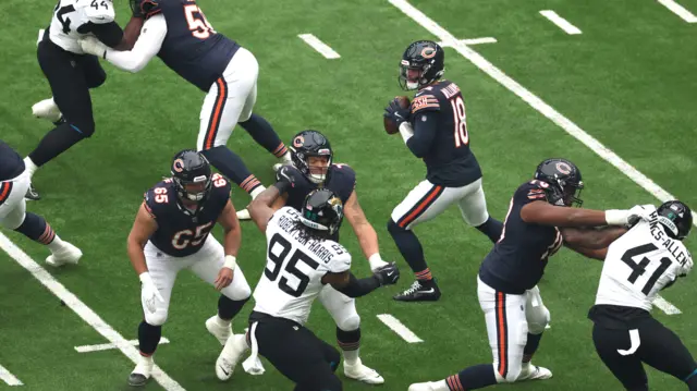 Caleb Williams prepares to throw the football