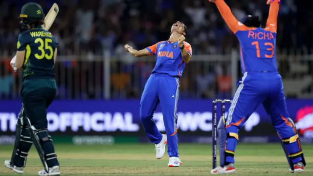 Renuka Singh of India celebrates taking the wicket of Georgia Wareham of Australia