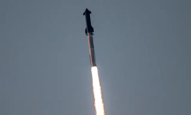 The rocket fires into the sky