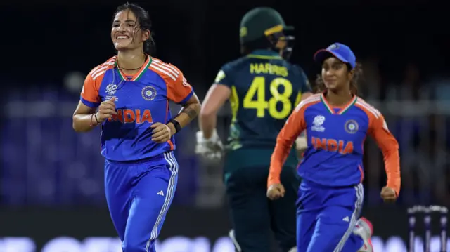 Renuka Singh of India celebrates taking the wicket of Beth Mooney of Australia during the Women's T20 World Cup