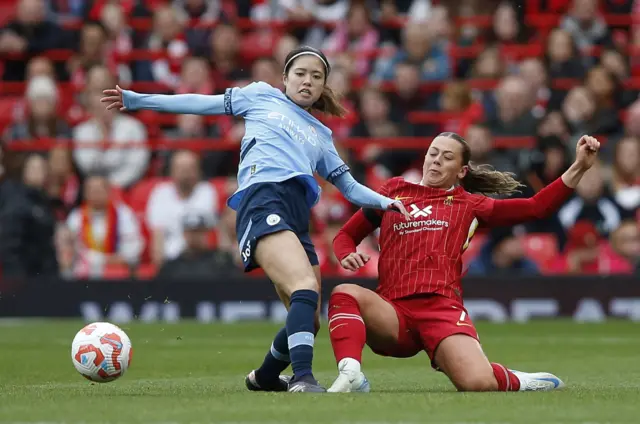 Manchester City's Yui Hasegawa in action with Liverpool's Cornelia Kapocs