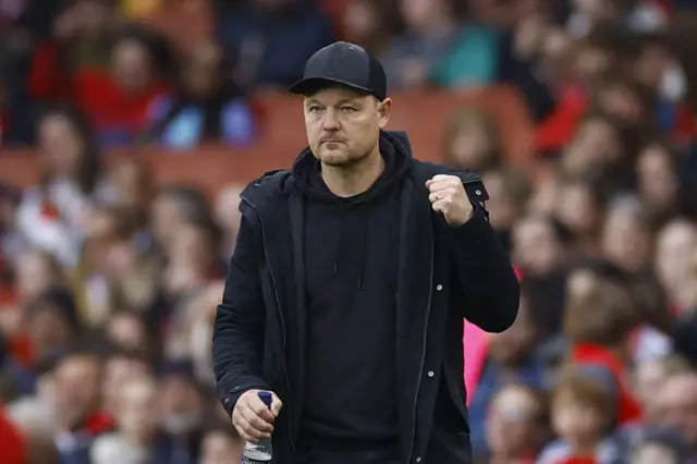 Brian Sorensen pumps his fist on the touchline