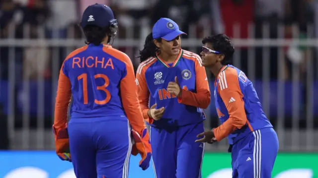 Deepti Sharma of India celebrates with team mates after taking the wicket of Grace Harris of Australia