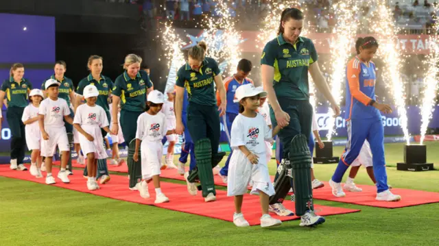 Tahlia McGrath and Harmanpreet Kaur lead out their team's ahead of the Women's T20 World Cup match