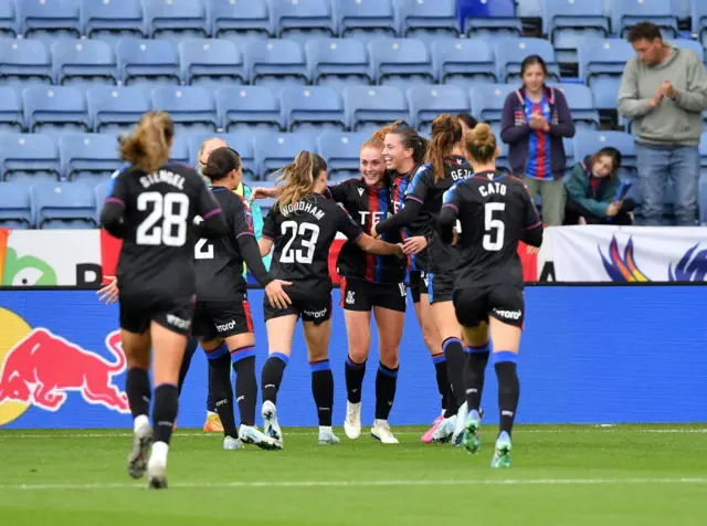 Palace players celebrate with Blanchard after she opens the scoring at Leicester