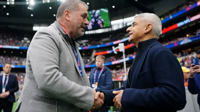 Tottenham manager Ange Postecoglou shakes hands with Mayor of London Sadiq Khan