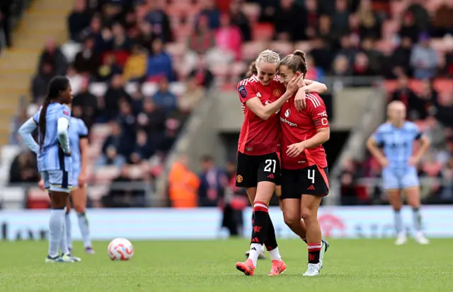 Maya Le Tissier of Manchester United celebrates scoring her team's third goal with teammate Millie Turner