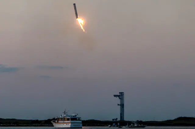 The booster begins to descend back to Earth