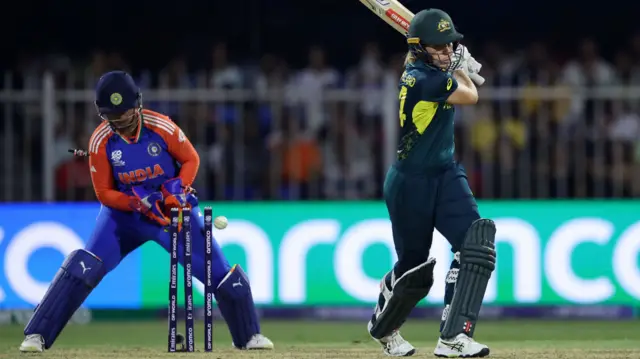 Annabel Sutherland of Australia is bowled by Shreyanka Patil of India