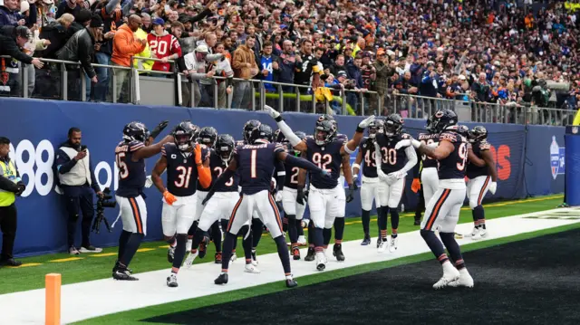 Chicago players celebrate a touchdown