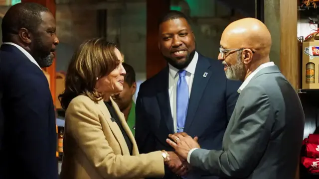 Kamala Harris shaking hands with a supporter