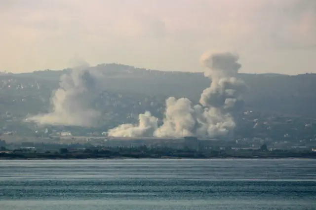 A photo taken from Tyre in southern Lebanon showing smoke rising in the distance from the site of an Israeli air strike targeting southern villages on Sunday