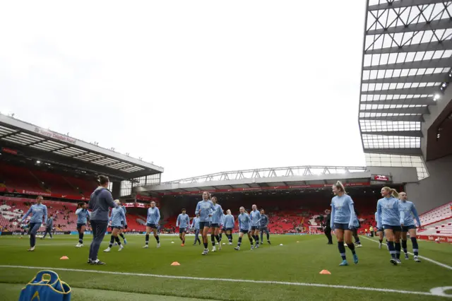 Manchester City players during the warm up before the match