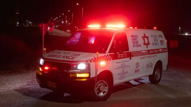 An ambulance leaves the scene of a drone strike near the northern Israeli town of Binyamina