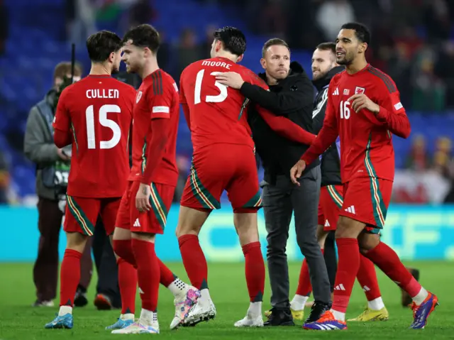 Craig Bellamy and his Wales players after the full-time whistle