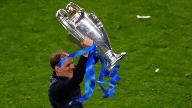 Thomas Tuchel celebrates with Champions League trophy