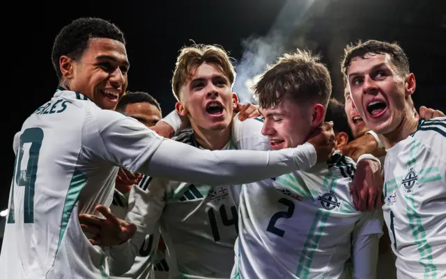 Northern Ireland's players celebrate Conor Bradley's goal