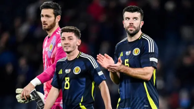 Scotland players applaud the crowd at full-time