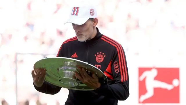 Thomas Tuchel of Bayern Muenchen with the Bundesliga Meisterschale trophy