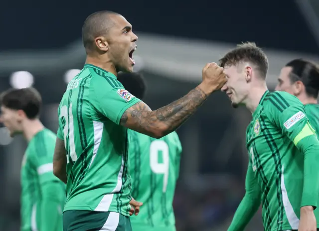 Josh Magennis celebrates