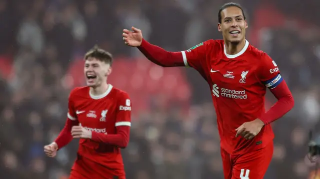 Conor Bradley and Virgil Van Dijk of Liverpool celebrate after their sides 1-0 extra-time win during the Carabao Cup Final.