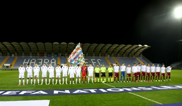 Northern Ireland players line up for the anthems