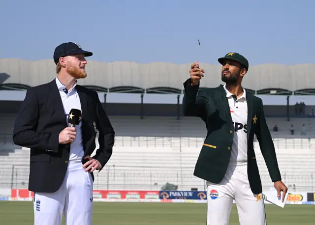 England captain Ben stokes looks on as Pakistan captain Shan Masood tosses the coin