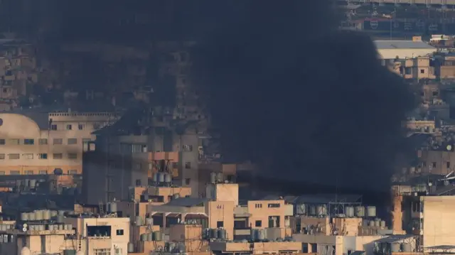 Thick, black smoke rising above Beirut's southern suburbs this morning