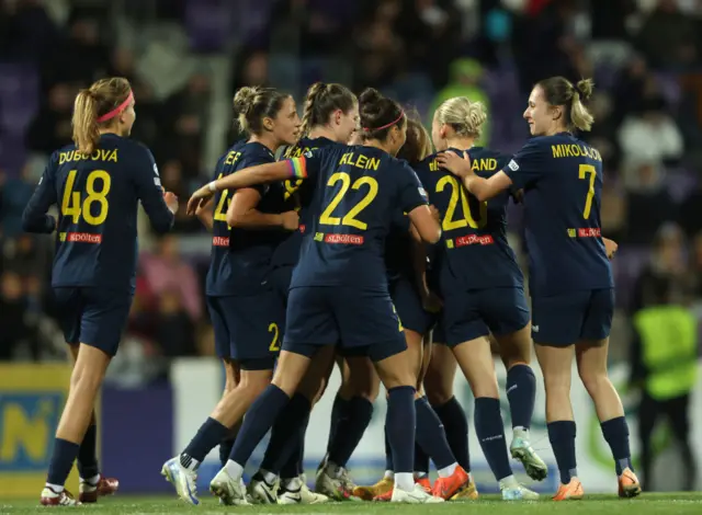 Melanie Brunnthaler celebrates with St Polten players after scoring