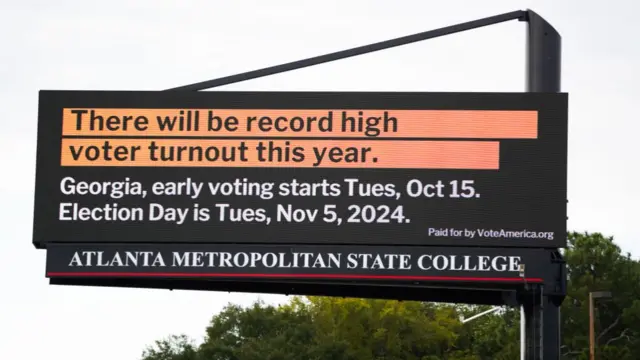 TLANTA, GEORGIA - OCTOBER 15: A billboard tells people the dates they are able to vote at Atlanta Metropolitan State College on October 15, 2024 in Atlanta, Georgia. Early voting takes place from October 15 - November 1, ahead of Election Day on November 5.