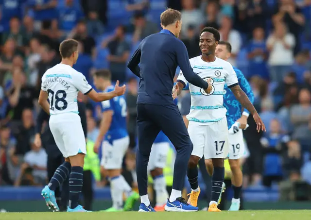 Thomas Tuchel, Manager of Chelsea, shakes hands with Raheem Sterling