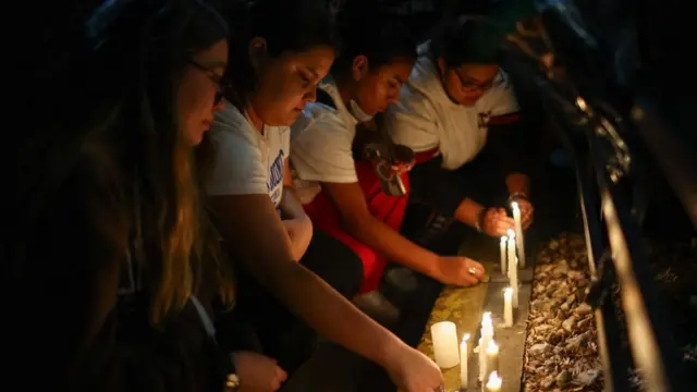 Fans place candles outside the hotel where Liam Payne, former One Direction member, was found dead, in Buenos Aires,