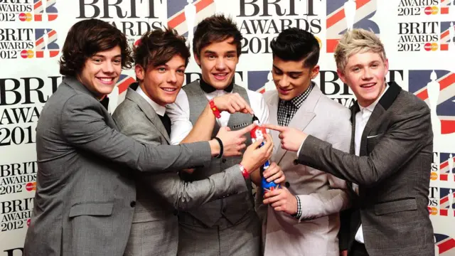 Harry Styles, Louis Tomlinson, Liam Payne, Zayn Malik and Niall Horan of One Direction with their award for Best British Single in the press room at the 2012 Brit Award