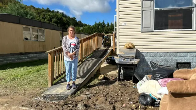 Cinda Galgano outside her home in Boone County, North Carolina days after flood water from Hurricane Helene destroyed her home