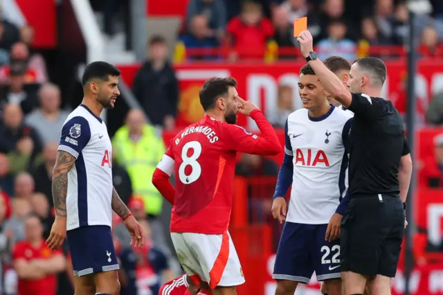 Bruno Fernandes being shown a red card against Tottenham