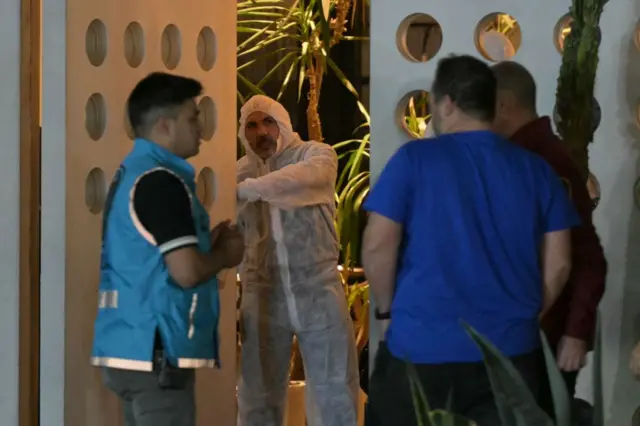 A forensic worker is pictured in the doorway of the hotel where British singer Liam Payne died in Buenos Aires