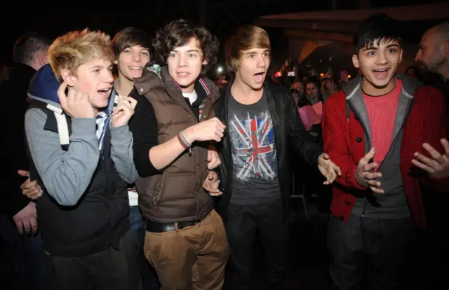 X Factor's One Direction left to right: Niall Horan, Louis Tomlinson, Harry Styles, Liam Payne and Zayn Malik arrive for an autograph signing session at the HMV store, Bradford in 2010