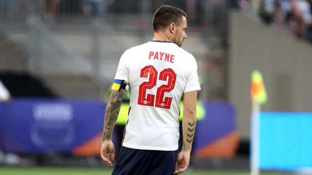 One Direction singer Liam Payne wears an England shirt as he walks off the pitch during the 2022 edition of Soccer Aid at the London Stadium