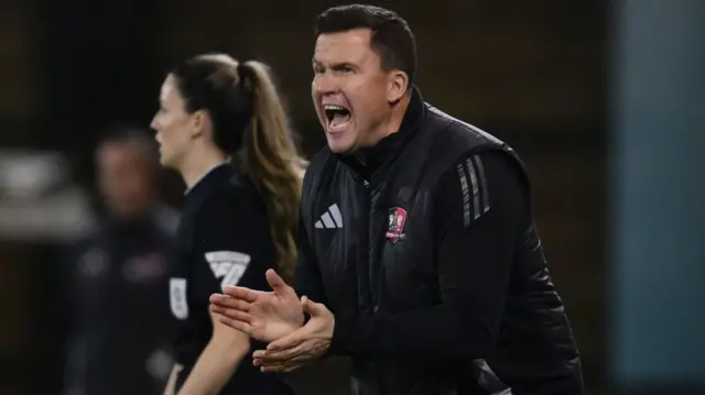 Exeter City manager Gary Caldwell shouts on the sidelines at Shrewsbury