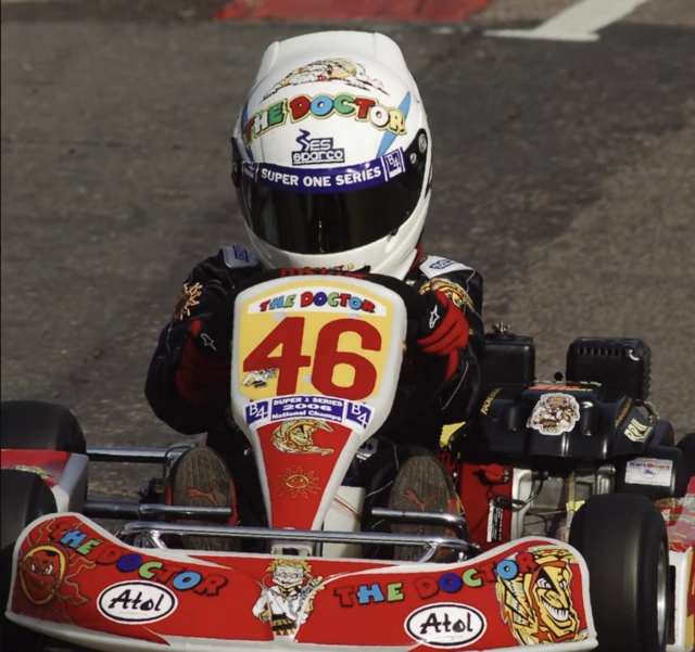 Alex Albon racing during his karting days, wering his very first helmet