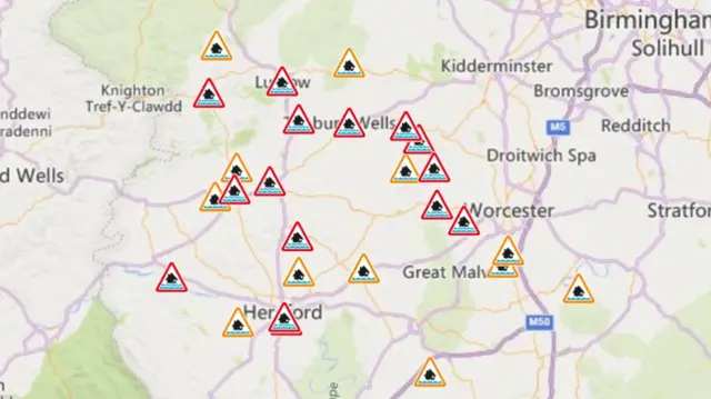 A map of the West Midlands with red and orange markers to show areas affected by flooding