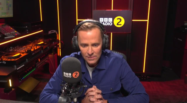 Scott Mills sits in the Radio 2 studio as he pays tribute to Liam Payne