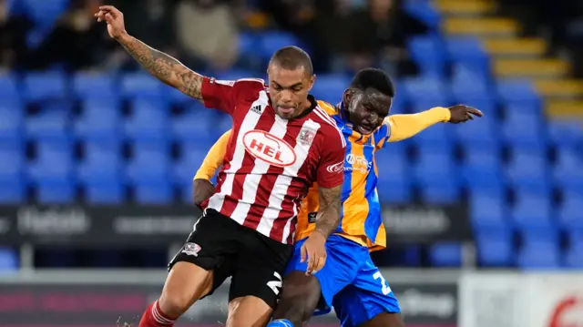 Josh Magennis in action against Shrewsbury