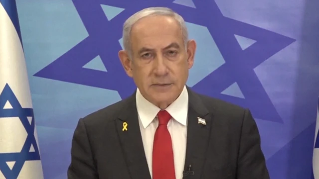 Benjamin Netanyahu speaking in front of a camera