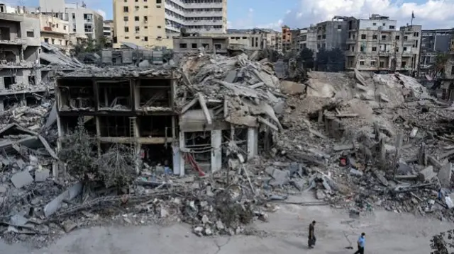 A wide shot showing destroyed buildings after Israeli air strikes in the southern city of Nabatieh yesterday.