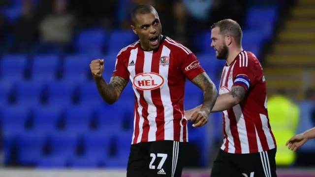 Exeter's Josh Magennis celebrates scoring at Shrewsbury