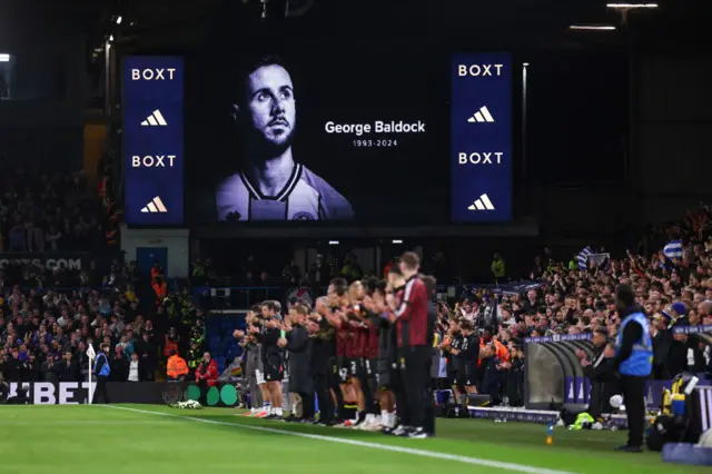 Fans, players and staff of both teams pay their respects to the late George Baldock, former player of Sheffield United