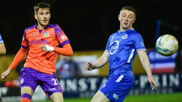 Josh Archer sends the ball forward for Linfield at Lakeview Park